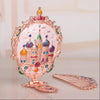 Hand held small mirror with a comb set